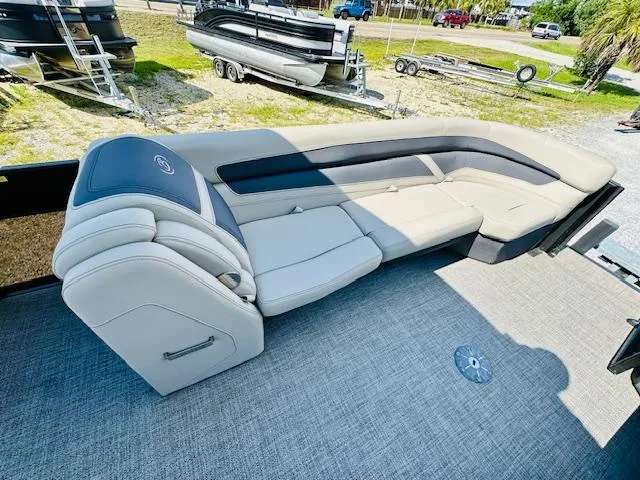 Slide: The Image of 2022 Barletta C24U pontoon boat interior with plush seating and modern design. - 10