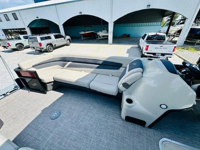 Slide: The Image of 2022 Barletta C24U pontoon boat interior with spacious seating and modern design. - 11