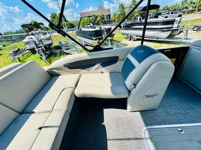 Slide: The Image of 2022 Barletta C24U pontoon boat interior with plush seating and modern design. - 17