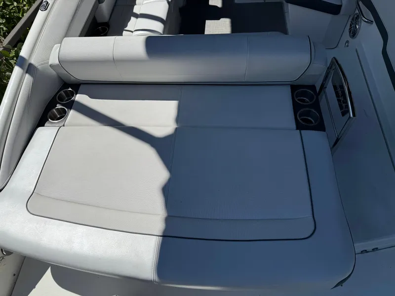 Slide: The Image of 2017 Formula 270 Bowrider boat interior with cushioned seating and cup holders. - 11