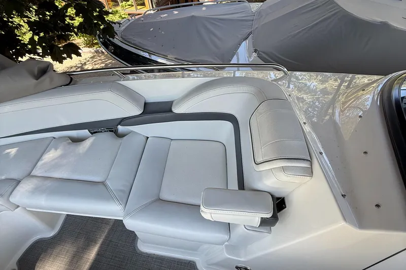 Slide: The Image of 2017 Formula 270 Bowrider interior with white leather seating and armrest. - 12