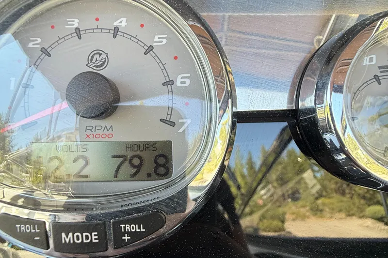 Slide: The Image of Close-up of a 2017 Formula 270 Bowrider boat gauge showing 79.8 hours and 2.2 volts. - 15