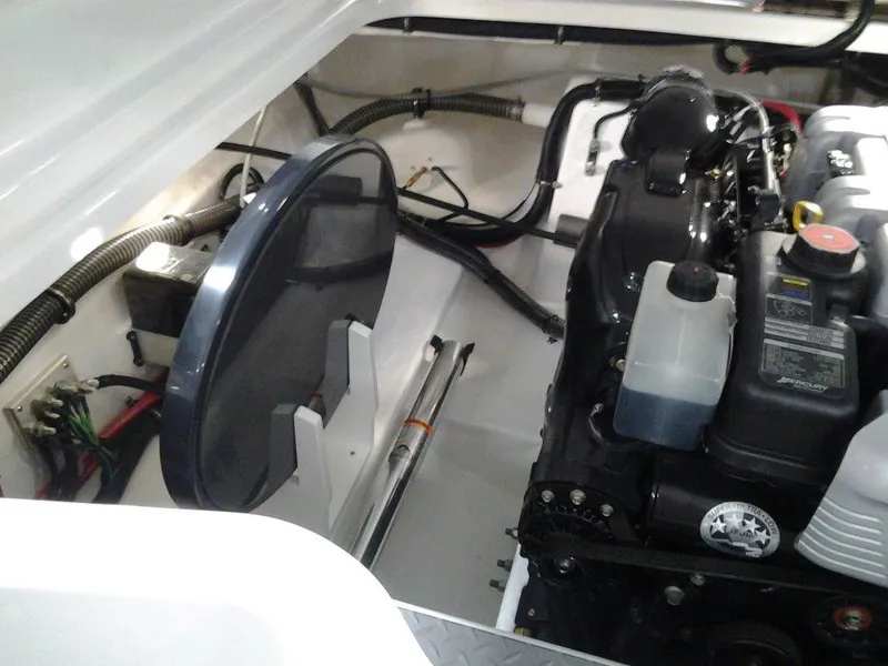 Slide: The Image of Engine compartment of a 2017 Formula 270 Bowrider boat, showcasing mechanical components. - 17