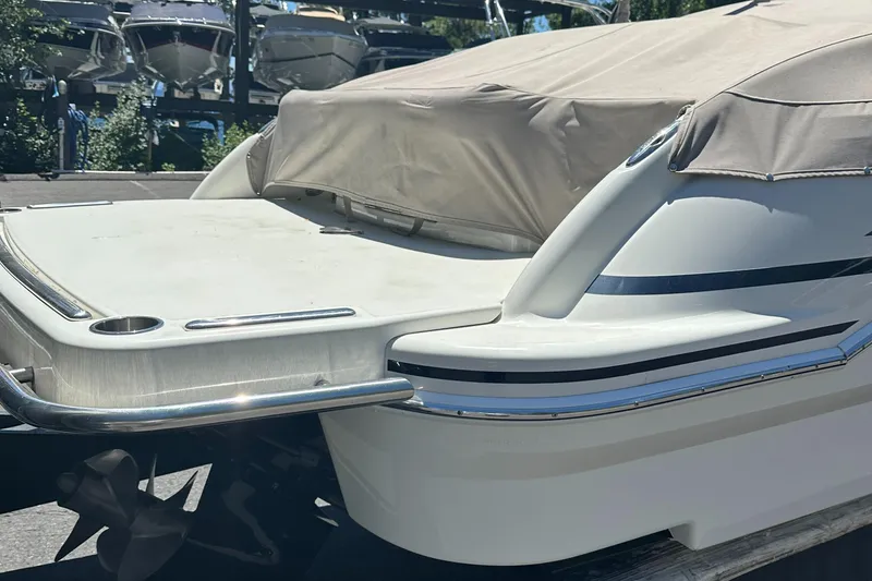 Slide: The Image of 2017 Formula 270 Bowrider boat with cover, docked in marina. - 4