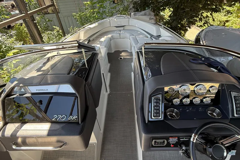 Slide: The Image of 2017 Formula 270 Bowrider boat interior with dashboard and seating area. - 6