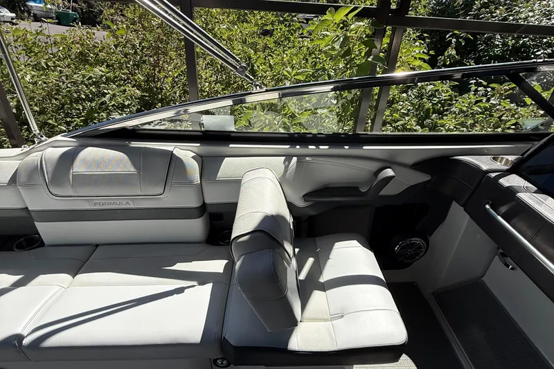 Slide: The Image of 2017 Formula 270 Bowrider interior with white seating and sleek design. - 8