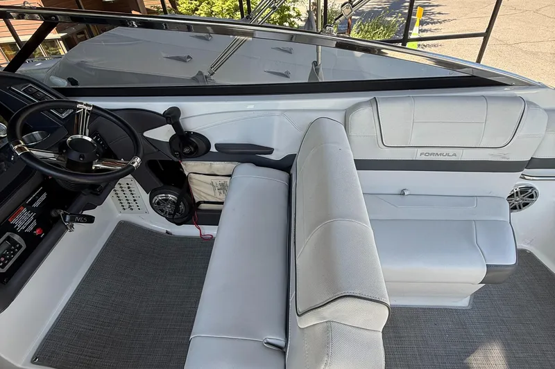 Slide: The Image of 2017 Formula 270 Bowrider interior with steering wheel and seating, showcasing modern design. - 9