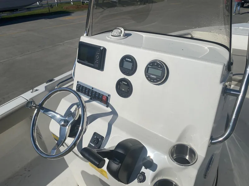 Slide: The Image of 2023 Key West 189 FS boat console with steering wheel and gauges. - 10