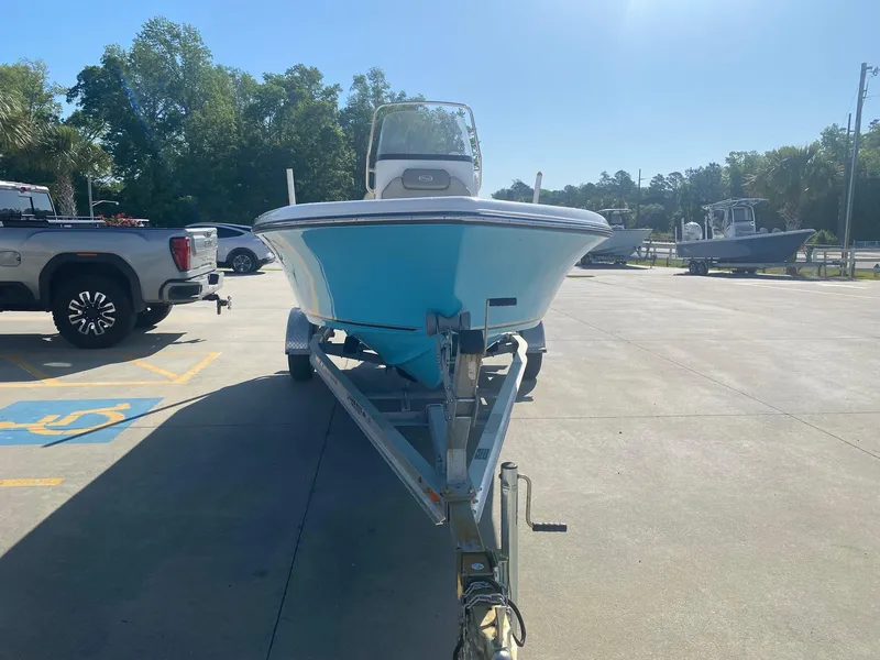 Slide: The Image of 2023 Key West 189 FS boat on trailer in parking lot, sunny day. - 2