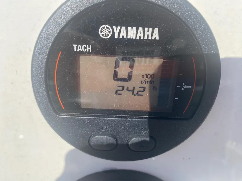 Slide: The Image of Yamaha tachometer displaying 0 RPM and 24.2 hours on a 2023 Key West 189 FS boat. - 3