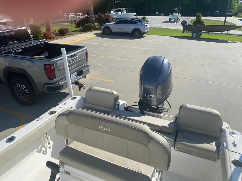 Slide: The Image of 2023 Key West 189 FS boat with Yamaha 115 engine in parking lot. - 7
