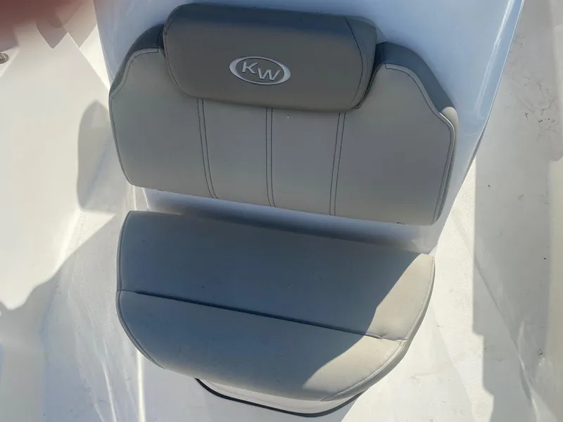 Slide: The Image of 2023 Key West 189 FS boat seat with gray upholstery and KW logo. - 8