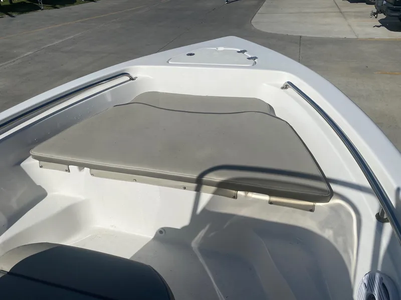 Slide: The Image of 2023 Key West 189 FS boat interior with cushioned seating and stainless steel railings. - 9