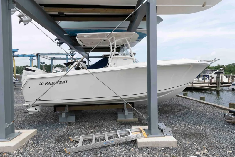Slide: The Image of 2016 Sailfish 240 CC boat on dry dock at marina. - 2