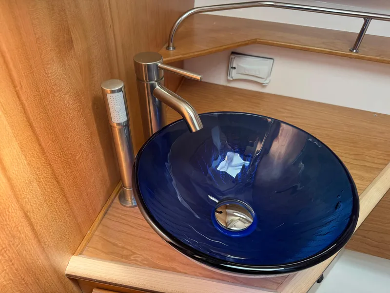 Slide: The Image of Modern blue glass sink in 2025 Cutwater C-288 Coupe boat interior. - 20