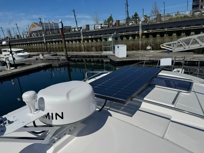 Slide: The Image of 2025 Cutwater C-288 Coupe with solar panel at marina dock. - 29