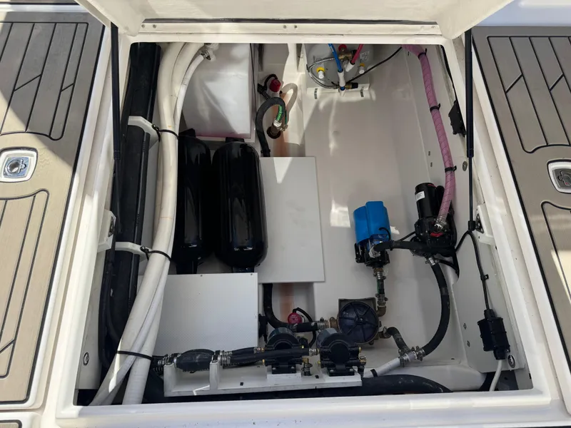 Slide: The Image of 2025 Cutwater C-288 Coupe engine compartment with visible components and wiring. - 30