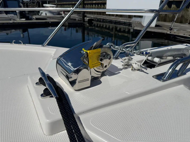 Slide: The Image of 2025 Cutwater C-288 Coupe boat deck with anchor winch and cleat. - 32