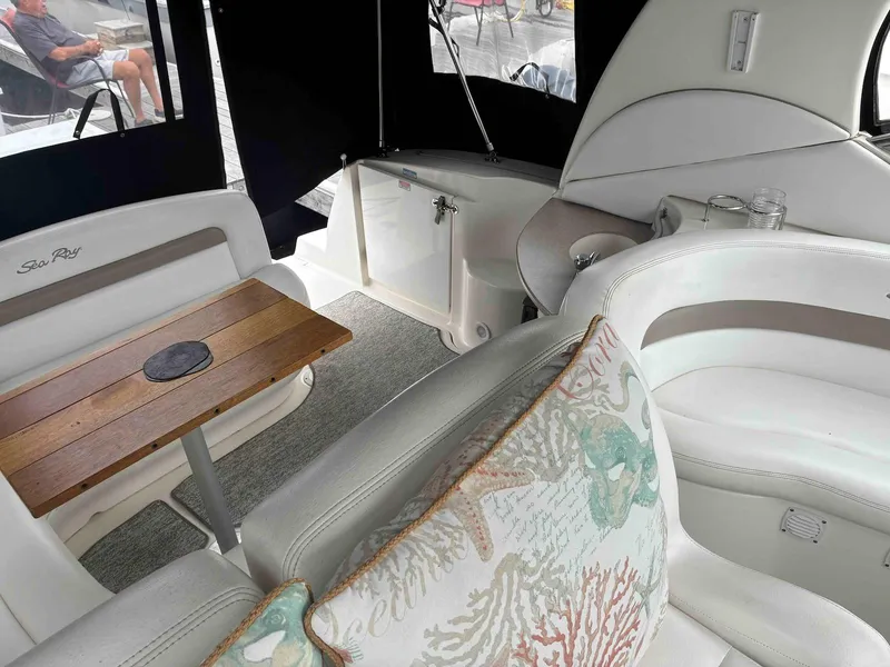 Slide: The Image of Interior of 2005 Sea Ray 320 Sundancer with elegant seating and wooden table. - 5