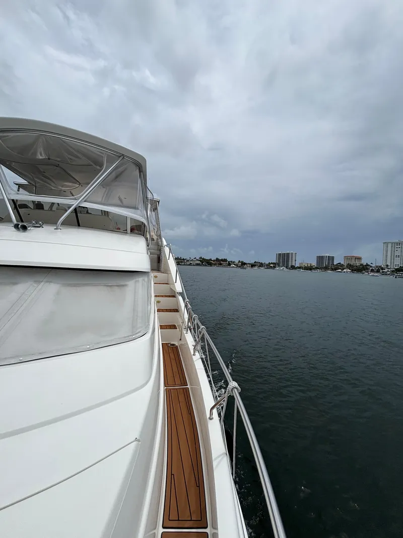 Slide: The Image of 2000 Silverton 453 Motor Yacht on calm waters under cloudy skies. - 14