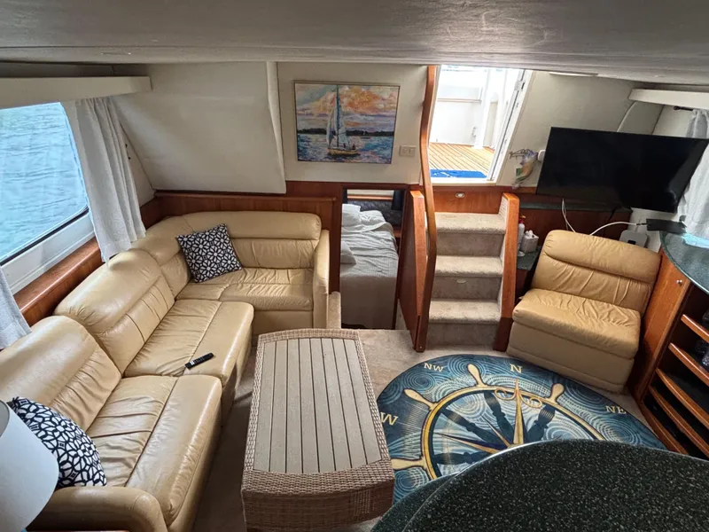 Slide: The Image of Luxurious interior of 2000 Silverton 453 Motor Yacht with leather seating and nautical decor. - 24