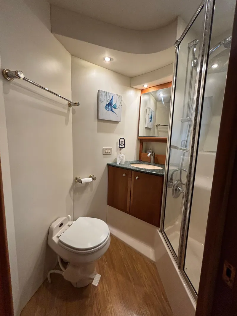 Slide: The Image of Bathroom interior of 2000 Silverton 453 Motor Yacht with shower and wooden flooring. - 30