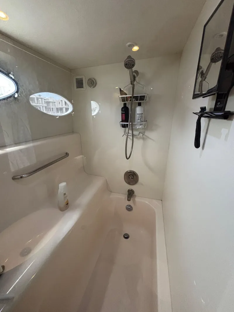 Slide: The Image of Bathroom interior of 2000 Silverton 453 Motor Yacht with shower and bathtub. - 36
