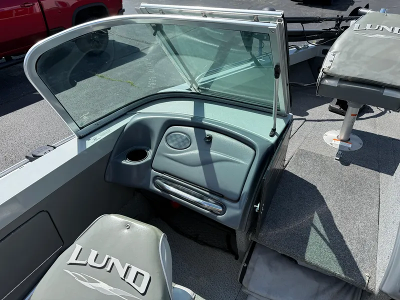 Slide: The Image of 2005 Lund 1700 Fisherman boat interior with windshield and seating. - 10