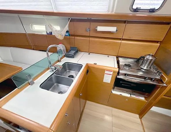 Slide: The Image of 2018 Jeanneau Sun Odyssey 389 yacht kitchen with dual sinks and stove. - 8