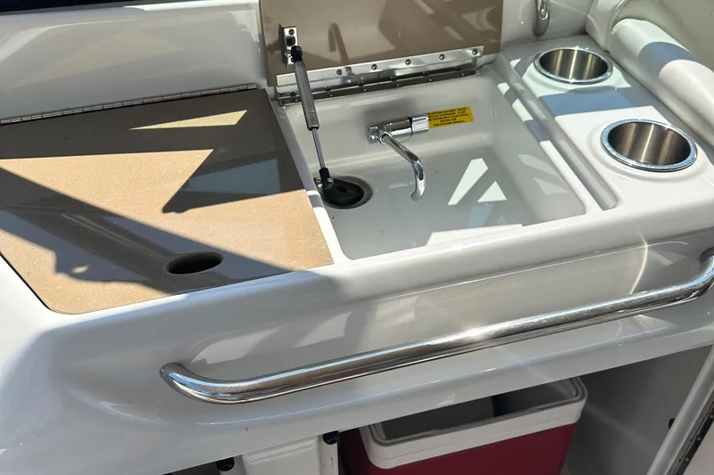 Slide: The Image of 2013 Formula 290 Bowrider sink area with faucet and cup holders. - 14