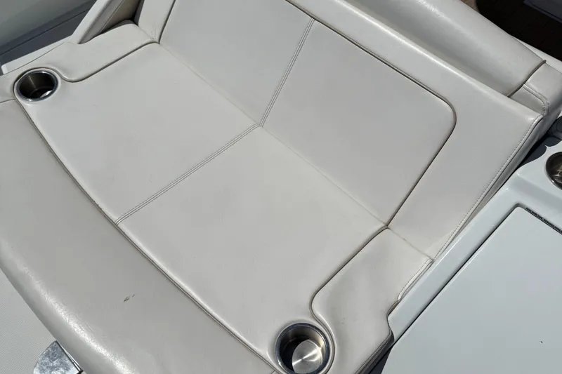 Slide: The Image of 2013 Formula 290 Bowrider white leather seating with cup holders. - 16