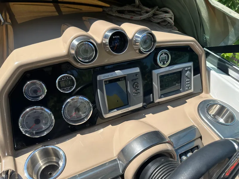 Slide: The Image of Dashboard of a 2013 Formula 290 Bowrider with navigation and control instruments. - 18