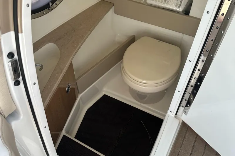 Slide: The Image of 2013 Formula 290 Bowrider boat bathroom with toilet and sink. - 20