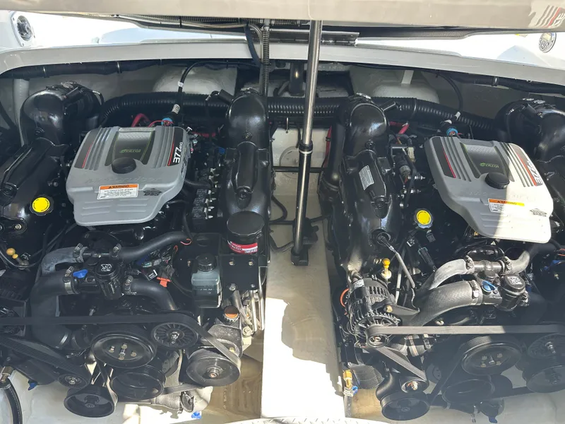 Slide: The Image of Twin engines of a 2013 Formula 290 Bowrider boat, showcasing detailed mechanics. - 22