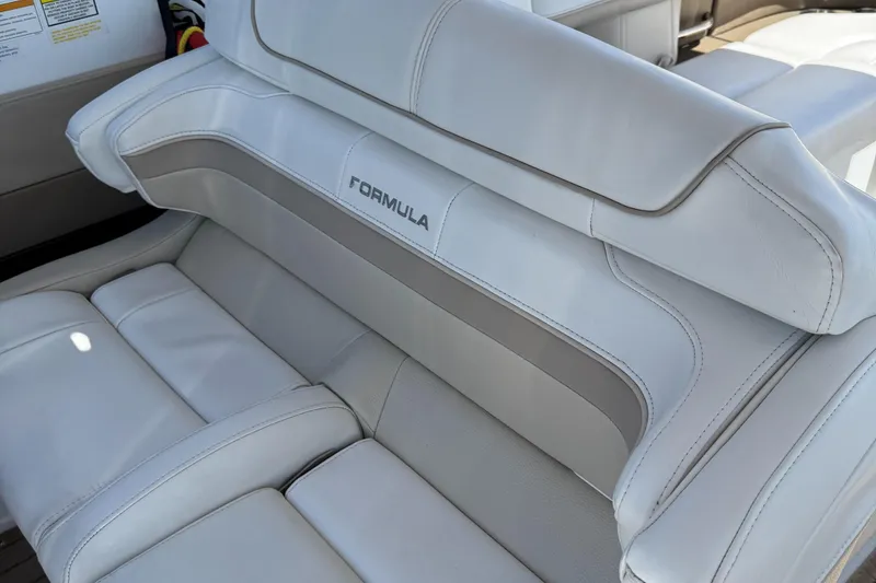 Slide: The Image of 2013 Formula 290 Bowrider boat seat with white and gray upholstery. - 8