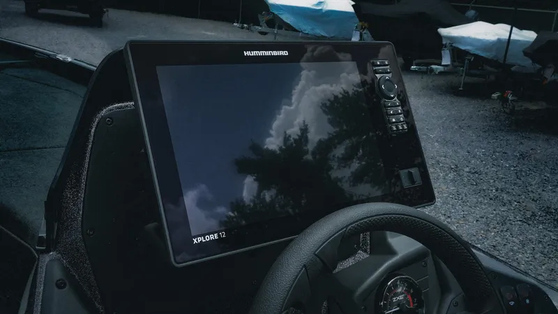 Slide: The Image of 2026 Skeeter ZXE 20 boat dashboard with Humminbird Xplore 12 display. - 20