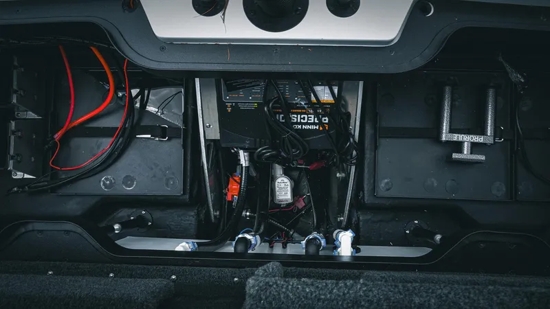 Slide: The Image of 2026 Skeeter ZXE 20 boat interior showing wiring and components. - 31