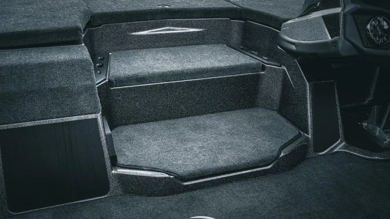 Slide: The Image of Interior of 2026 Skeeter ZXE 20 boat with carpeted steps and seating area. - 33