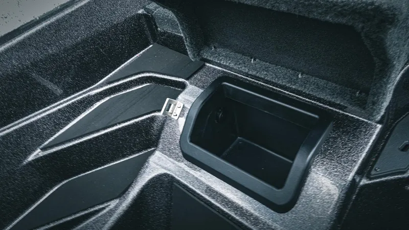 Slide: The Image of 2026 Skeeter ZXE 20 boat storage compartment with open lid, showcasing interior design. - 34