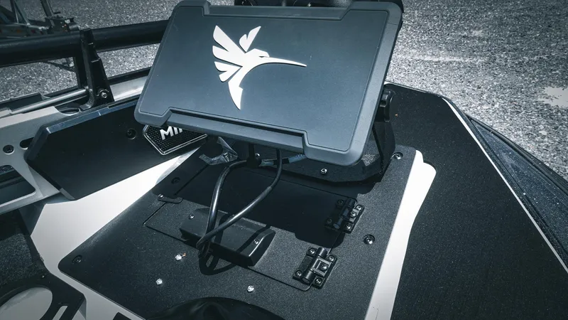 Slide: The Image of 2026 Skeeter ZXE 20 boat dashboard with mounted electronic device and logo. - 41