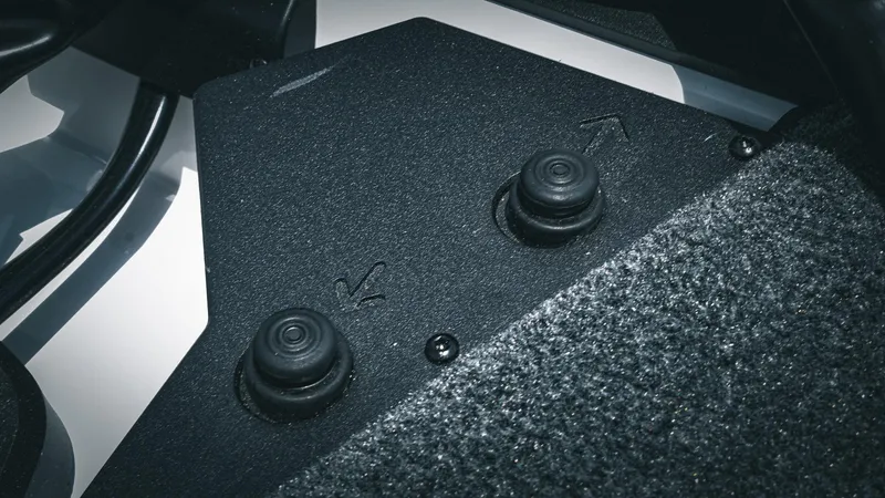 Slide: The Image of Close-up of 2026 Skeeter ZXE 20 boat control panel with textured surface and buttons. - 44