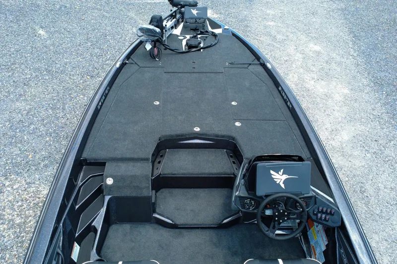 Slide: The Image of 2026 Skeeter ZXE 20 boat interior with steering console and spacious deck. - 5