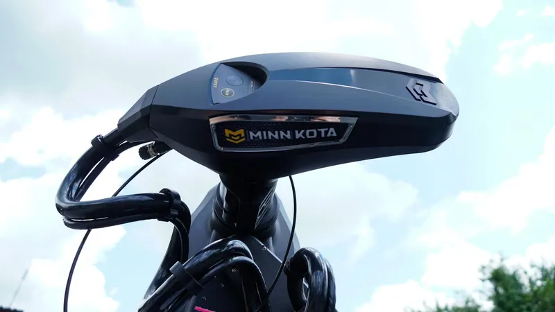 Slide: The Image of Minn Kota motor on 2026 Skeeter ZXE 20 boat against cloudy sky. - 7