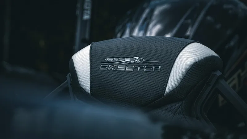 Slide: The Image of Skeeter ZXE 20 boat seat, 2026 model, featuring sleek black and white design. - 8