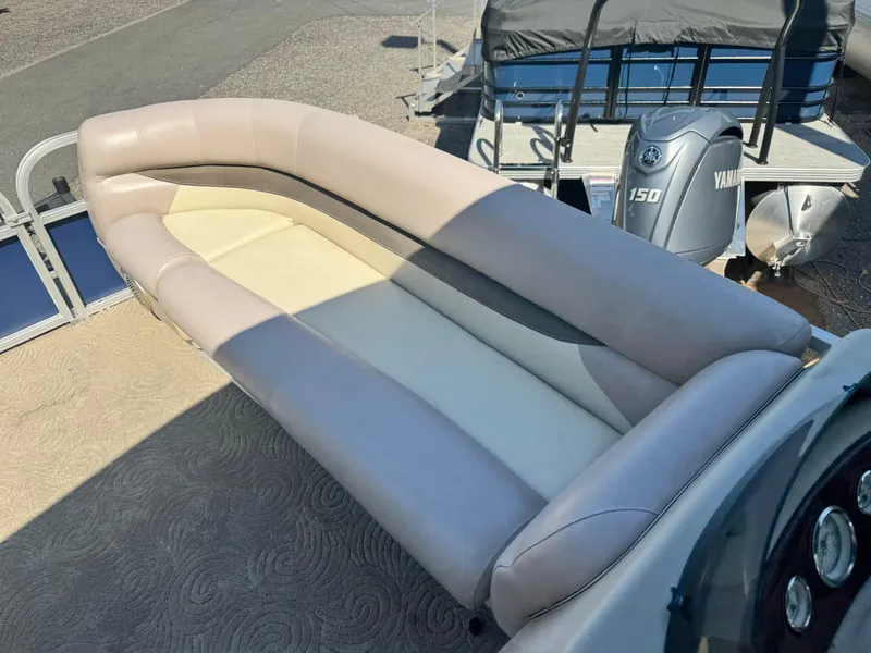 Slide: The Image of 2014 Sun Tracker Party Barge 20 DLX with beige seating and Yamaha 150 engine. - 8