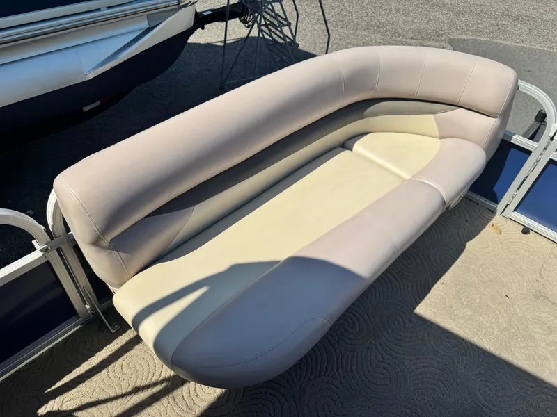 Slide: The Image of 2014 Sun Tracker Party Barge 20 DLX pontoon boat seating, beige upholstery, outdoor setting. - 9