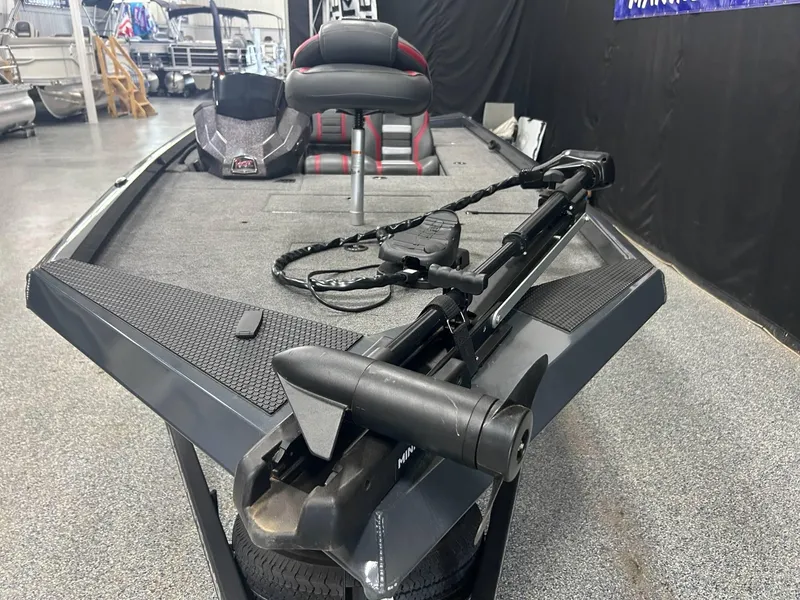 Slide: The Image of 2022 Ranger RT178C fishing boat on display in showroom with trailer. - 4