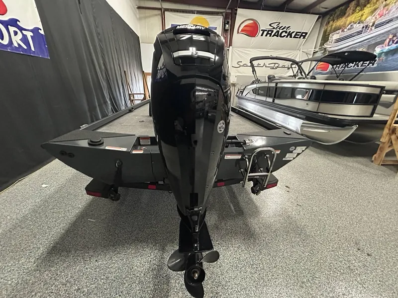 Slide: The Image of 2022 Ranger RT178C boat interior with seat and trolling motor in garage. - 8