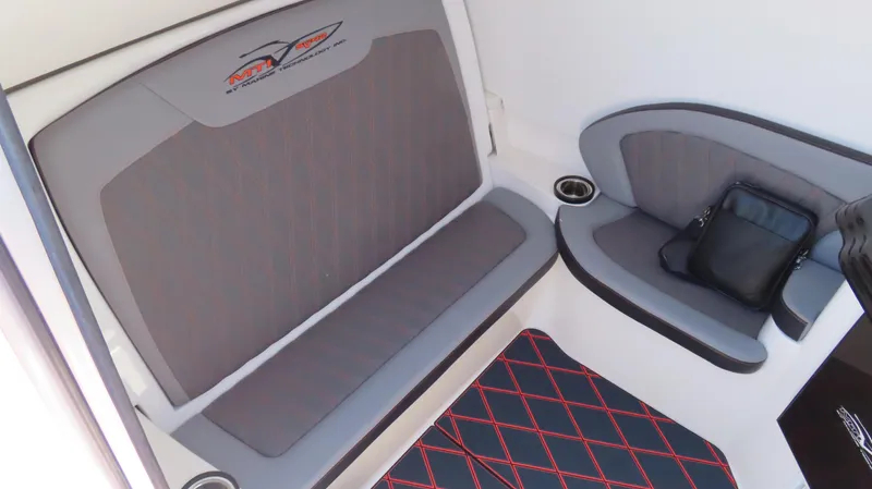 Slide: The Image of Interior seating of 2020 MTI 42V boat with gray upholstery and cup holders. - 11