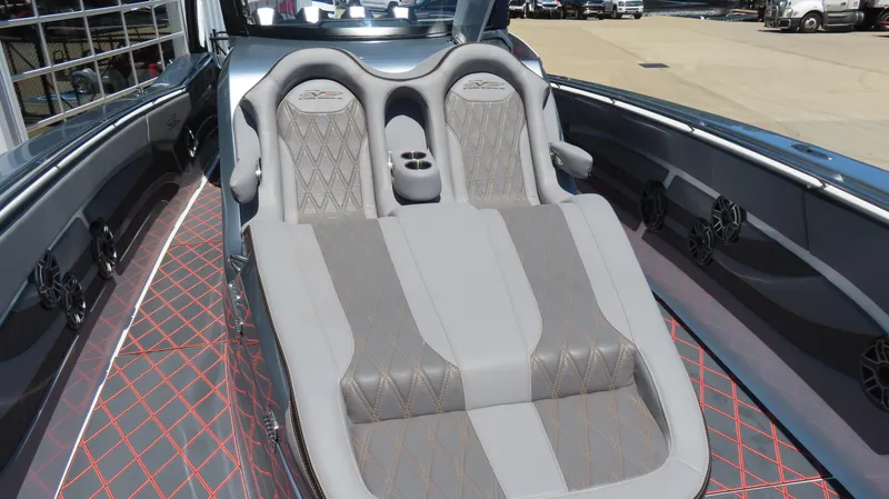 Slide: The Image of Luxurious seating on 2020 MTI 42V boat with diamond-stitched upholstery and cup holders. - 14
